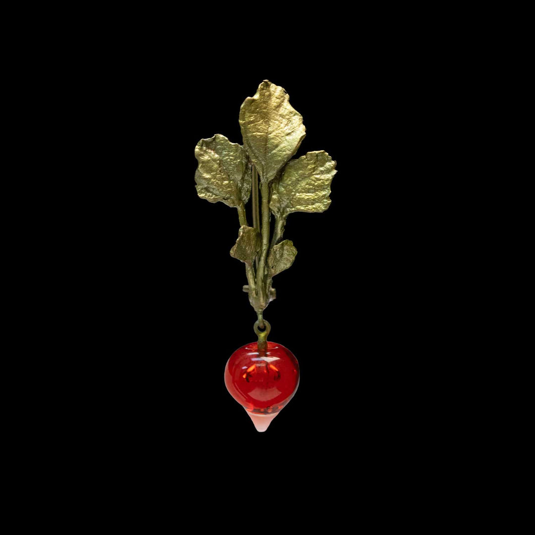 A green leaf vegetable pendant shaped like a radish with a hanging red glass bulb, shown against a solid black background.