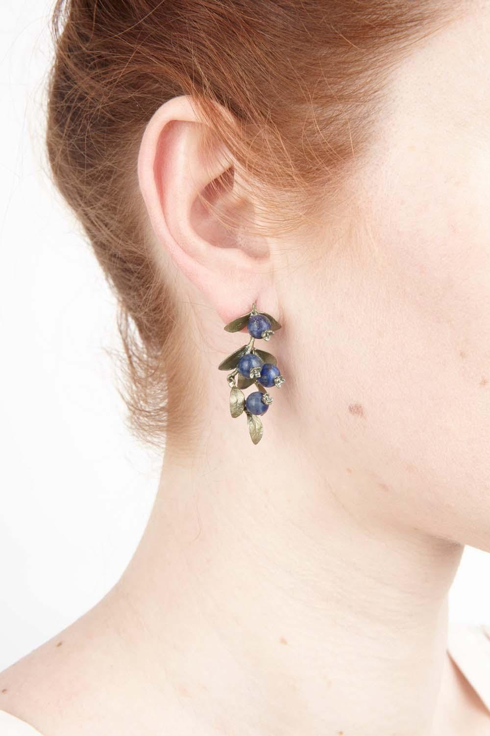The Blueberry earrings are cast in bronze and accented with dark blue aventurine berries. The posts are 925 silver.
